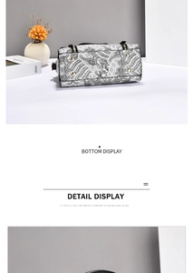 Close-up of bottom metal studs and wave embroidery on the minimalist shoulder bag
