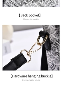 Detail of the magnetic buckle and golden metal clasp on a textured jacquard handbag
