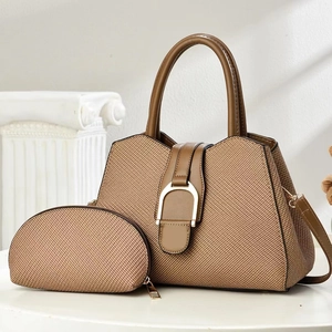 Stylish woven tote bag with brown leather handles and a matching coin purse set