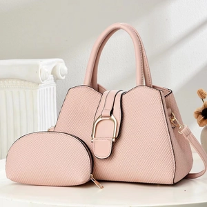 Pink tote bag set with horsebit hardware, woven texture, and round coin purse accessory