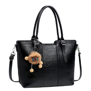 Classic black PU leather tote bag with oil-wax finish and cute lion charm accessory