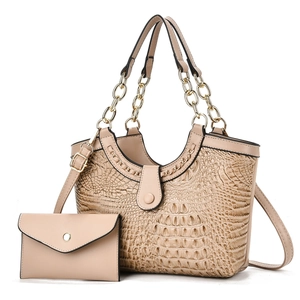 Detail of apricot crocodile embossed tote bag set with golden chain handle and small clutch