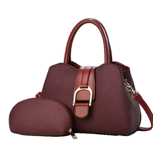 Deep burgundy 2-piece handbag set with textured honeycomb fabric and gold hardware