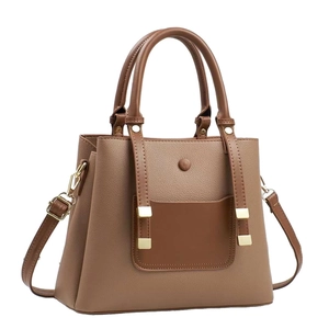 Deep beige faux leather tote bag with lychee texture and brown pocket, 45-degree angle view