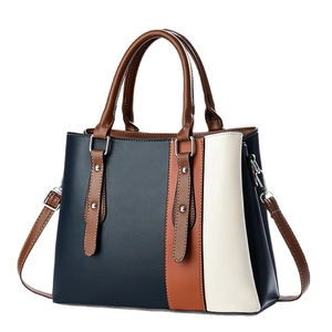 Chic tricolor patchwork handbag in navy blue, brown and cream leather for women