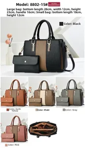 Dettaglio della borsa tote in pelle PU con strisce verticali e scomparti interni