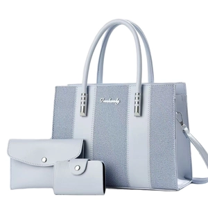 Three-piece light blue composite handbag set with striped texture and metal hardware