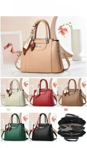 Litchi pattern leather handbag with dimensions 27x12x21cm showing internal structure details