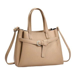 Classic khaki pebbled leather handbag with top handles and adjustable shoulder strap
