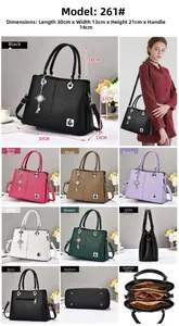 Close-up detail of litchi texture PU leather handbag with metal knot charm and inner compartments