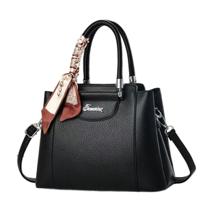 Elegant black pebbled leather tote bag with decorative silk scarf and silver logo