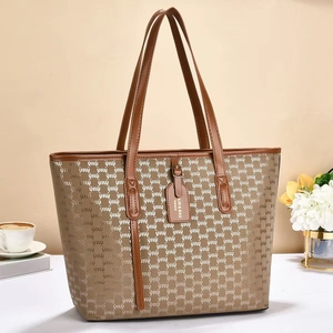 Classic patterned large capacity tote bag with brown leather handles and vintage texture