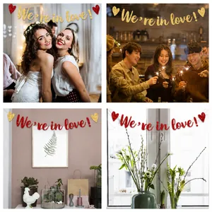 Detail of 'We're in love' heart banner in red and gold sequins for wedding decor