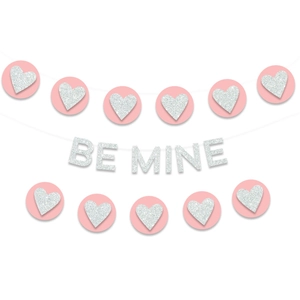 Detail of pink and silver glitter heart garland with Be Mine lettering banner