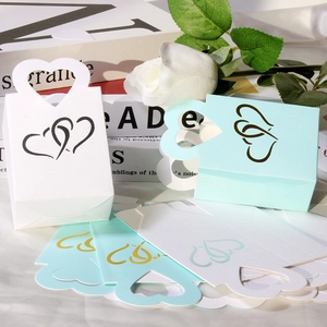 Boîtes à bonbons en papier kraft découpé au laser en blanc et vert menthe