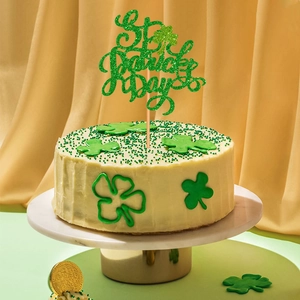 Glittery green St. Patrick's Day cake topper with clover design for party decorations
