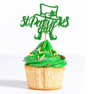 Glitter St. Patrick's Day cake topper with green shamrock hat and boots decorations