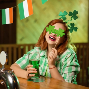 St. Patrick's Day party set with lucky clover headband and green shamrock handheld mask
