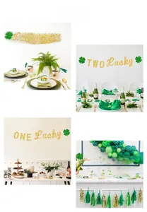Close-up of gold glitter Lucky Baby party banner with green shamrocks for Saint Patrick's Day