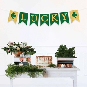 LUCKY banner for St. Patrick's Day with green swallowtail flags and golden shamrocks