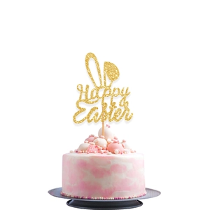 Glittery gold Happy Easter cake topper with bunny ears on a soft cream cake