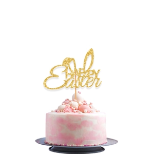 Sparkling gold Happy Easter cake topper with rabbit ears on a white cream cake