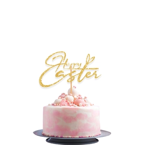 Glittering Happy Easter gold cake topper inserted into a marble patterned cream cake