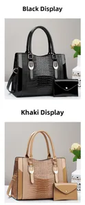 Detail of faux crocodile leather tote set in black and khaki with adjustable straps