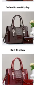 Detail view of croc-embossed patent leather tote and wallet set in brown and red