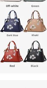 Detailed view of six colors of embroidered tote bags with floral patterns and silk scarves