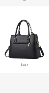 Back view of black leather handbag with rear zipper pocket and printed silk scarf handle