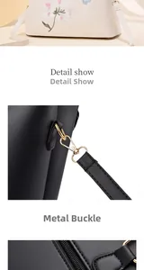Detail view of floral embroidery, golden metal hooks and zipper on the leather tote bag