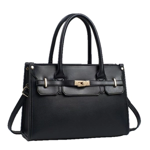Structured black leather tote bag with gold hardware and dual handles for women