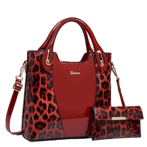 Red patent leather handbag and leopard print wallet set with gold hardware and strap