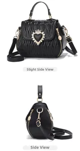 Detail view of black quilted leather handbag with crown heart diamond decoration
