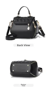 Detailed back and bottom view of black quilted crossbody bag with gold protective studs