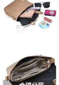 Detail of the spacious interior compartments and textured lining in this camel leather bag