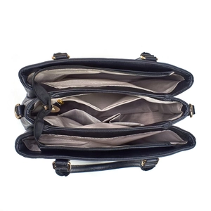 Vue de dessus montrant les trois compartiments intérieurs spacieux et les zips dorés du sac à main