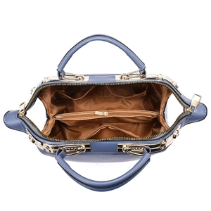 Top view showing spacious interior compartments of dusty blue floral embroidery pillow bag