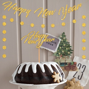 Glittery gold Happy New Year banner set with hanging dots and cake topper decoration