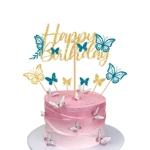 Close-up of glittery Happy Birthday cake topper with colorful butterfly decorations