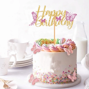 Golden glitter Happy Birthday cake topper with pink and purple butterflies on rainbow cake