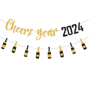 Detail of glittery black and gold 2024 New Year banner with champagne bottle garlands
