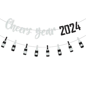 Detail of 2026 glitter party banner featuring silver Cheers year and champagne accents