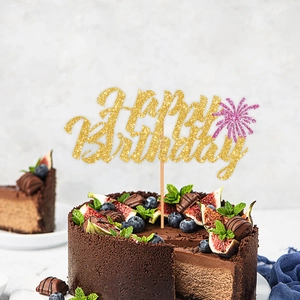 Glittery Happy Birthday cake topper with elegant gold and pink cursive lettering on cake
