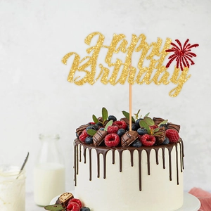 Golden glitter Happy Birthday cake topper with red fireworks design on chocolate cake
