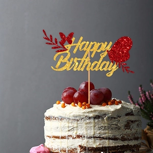 Glittering Happy Birthday cake topper with red butterflies and hearts on cream cake