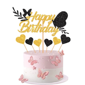 Detailed view of gold Happy Birthday cake topper set with glitter butterflies and hearts