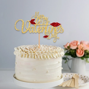Golden glittery Happy Valentine's Day cake topper with red lips on a white cream cake