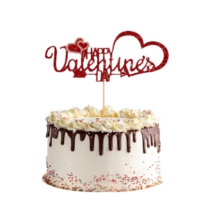 Red glitter Happy Valentine's Day cake topper with hearts on a chocolate cream cake